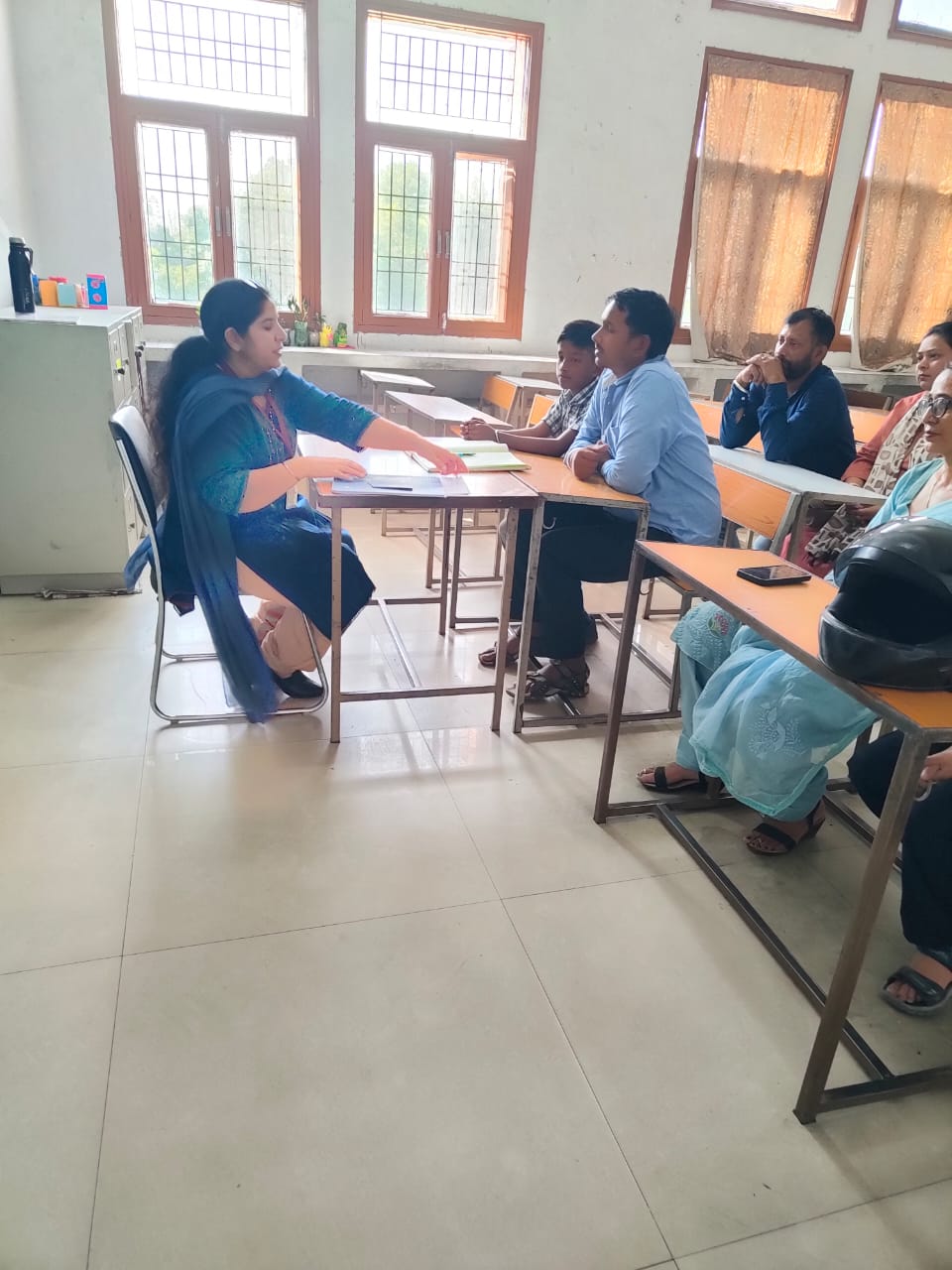 Teacher explaining documents to a father